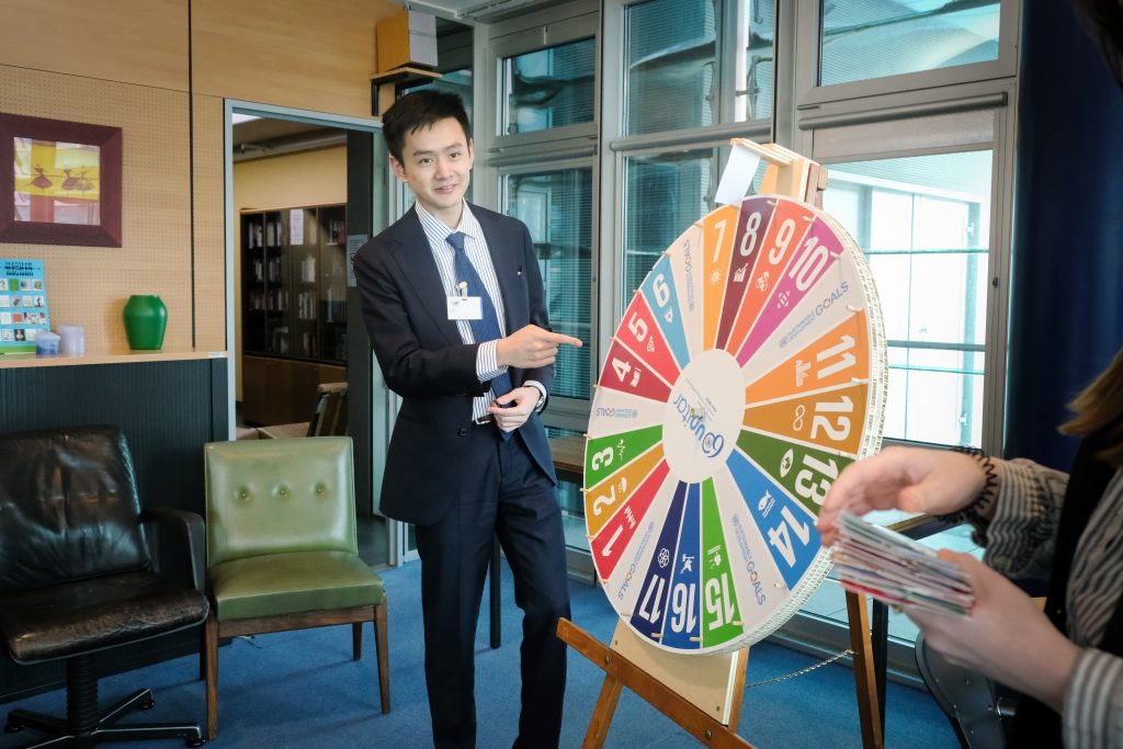 Student spinning the SDG wheel during the SDG game.